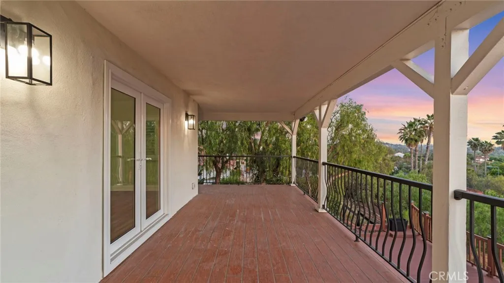 Wrap-around covered balcony off master suite