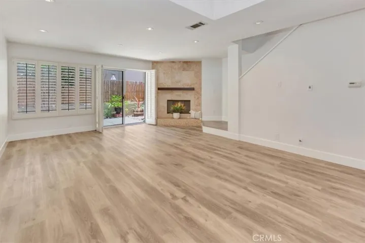 Living Room - notice custom hearth and rich wood mantle!