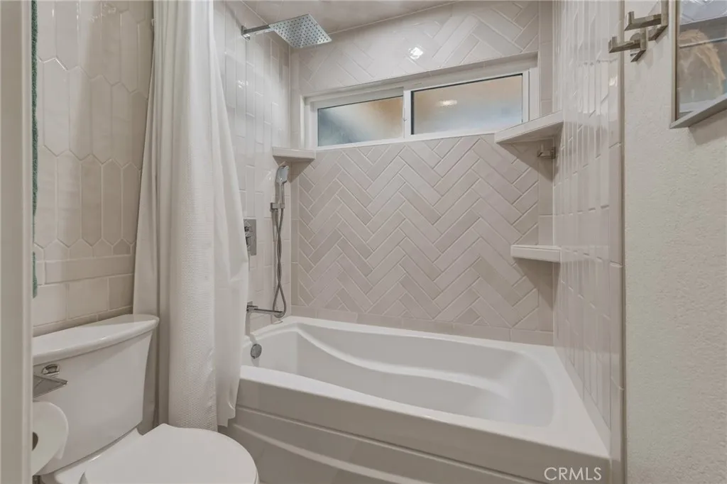 Second bathroom soaker tub with shower