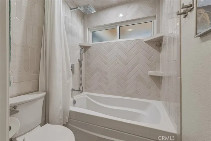 Second bathroom soaker tub with shower