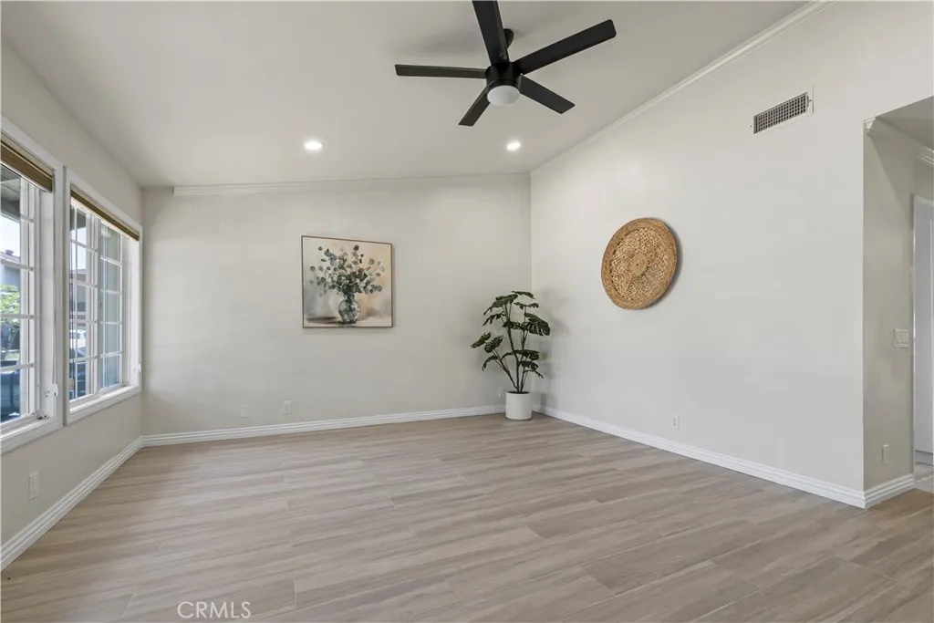 Light-filled living space with wood tile flooring and open layout