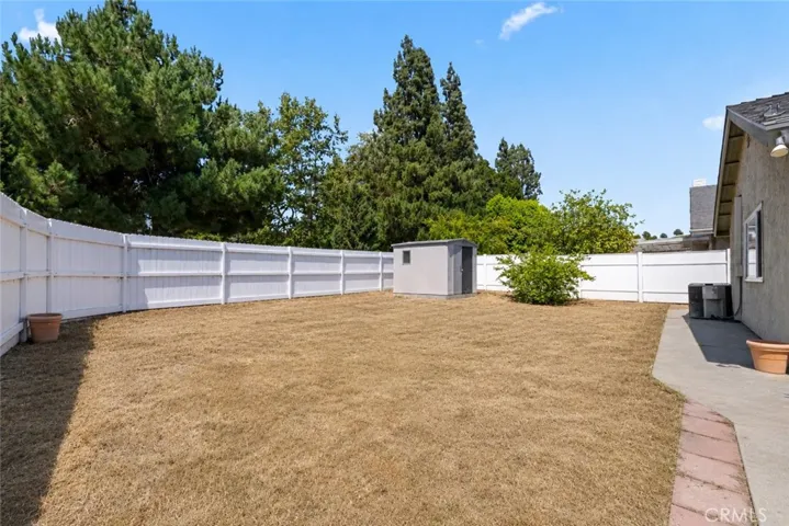 Virtually enhanced - Expansive backyard with mature trees and direct park views