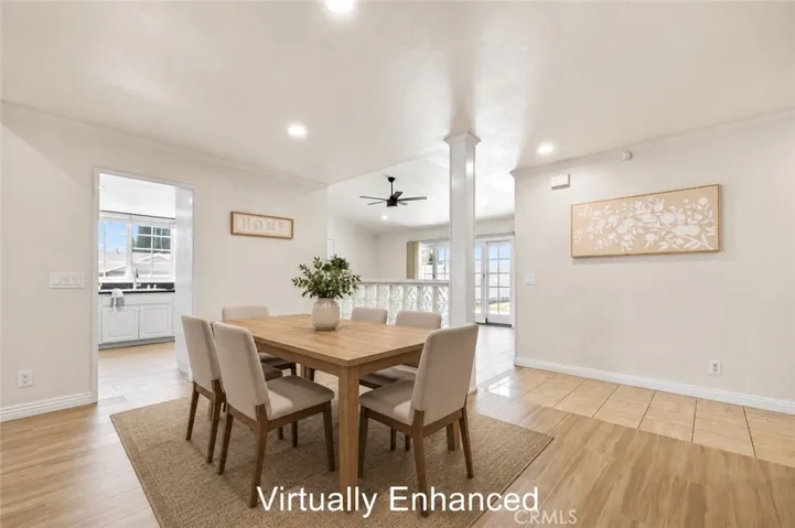 Elegant dining area with recessed lighting and sliding glass doors