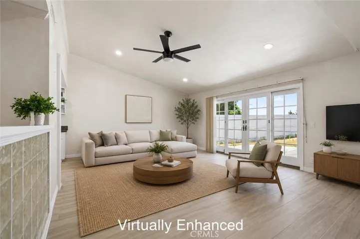Cozy family room with ceiling fan and natural light