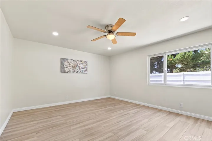 Primary bedroom with neutral finishes and ample closet space