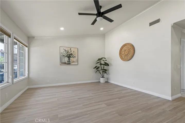 Light-filled living space with wood tile flooring and open layout