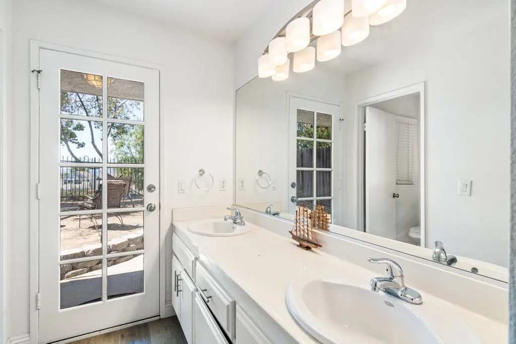On Suite Bath with door out to back yard.