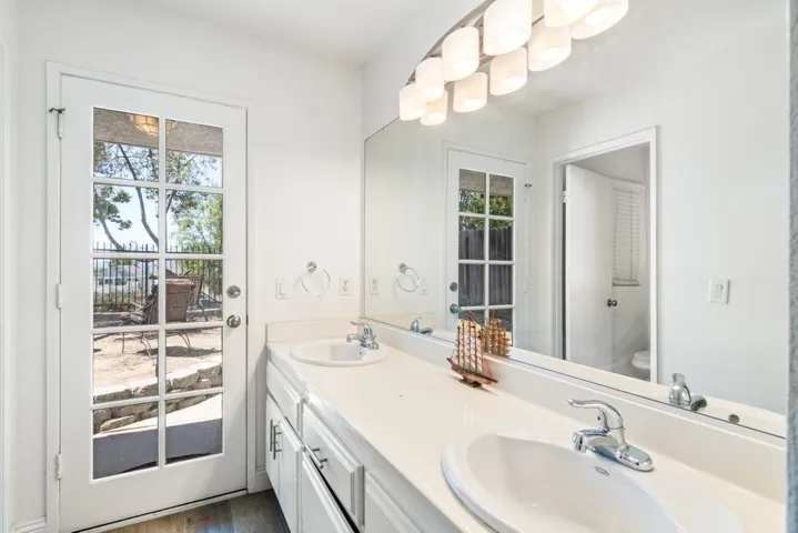 On Suite Bath with door out to back yard.