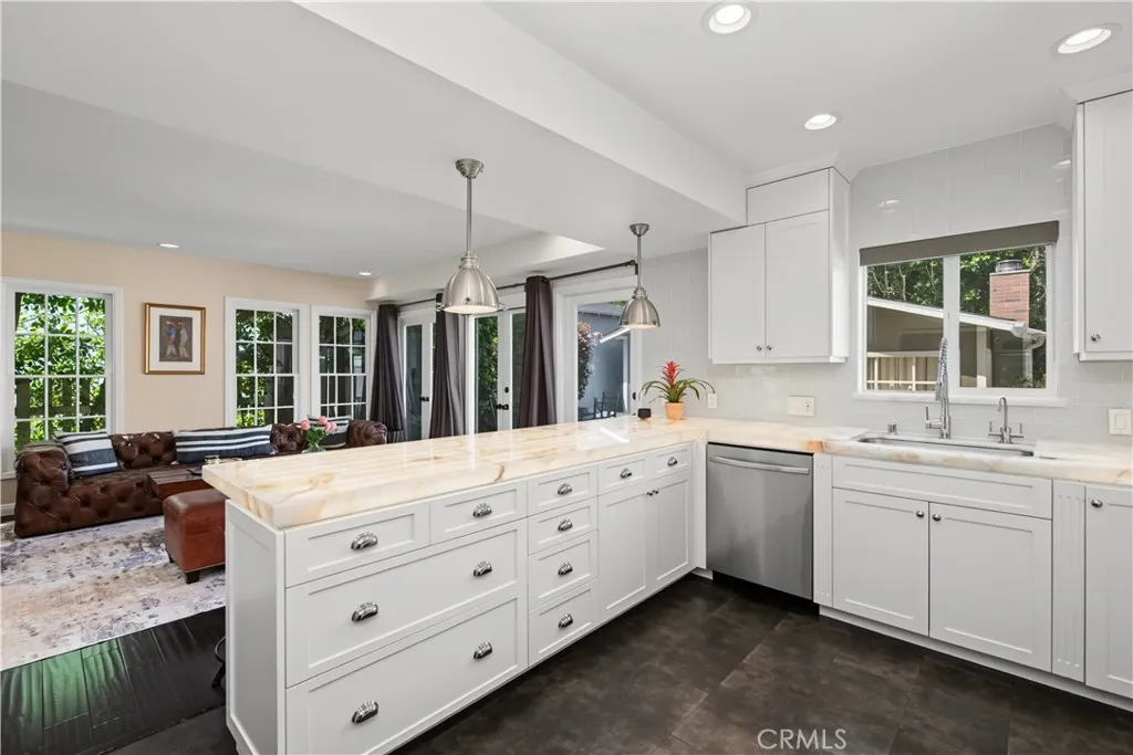 Kitchen with view of tv room
