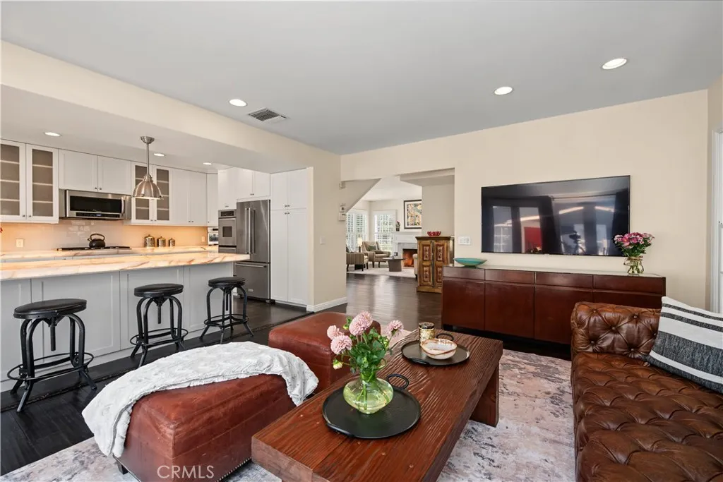 TV room with view of kitchen and living room