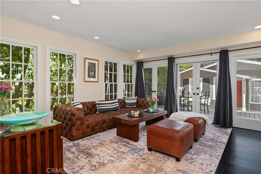 TV room with kitchen adjacent