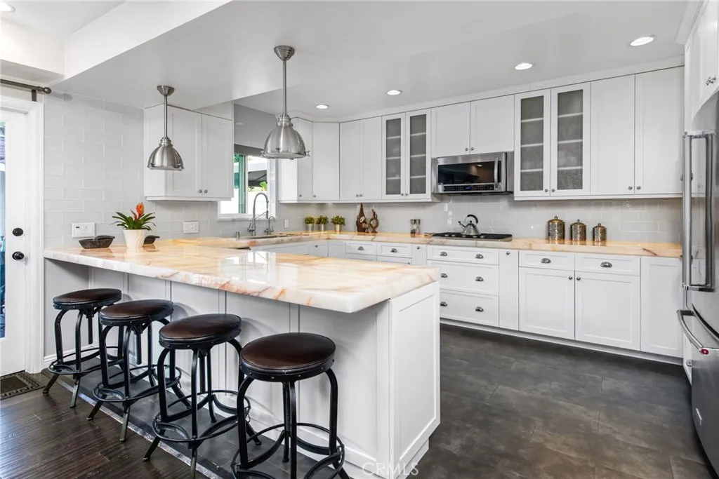 kitchen with illuminated quartzite counter tops