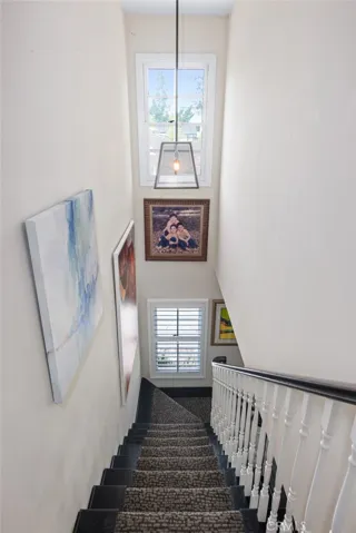 view of the staircase from upstairs bedrooms