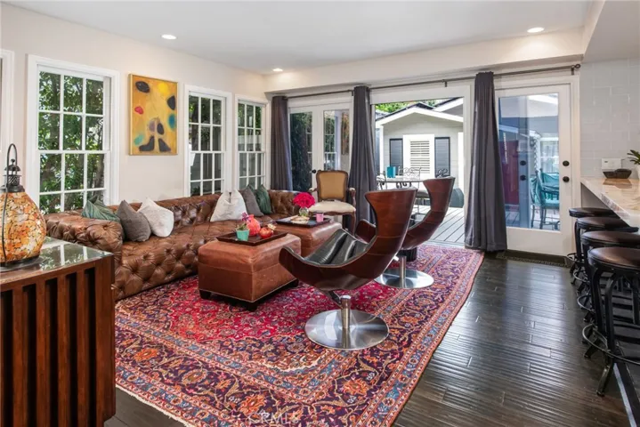tv room with deck in the background
