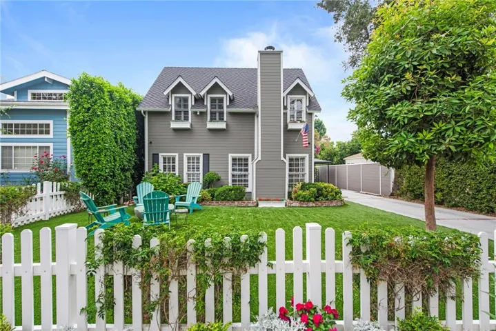large front yard with fire pit and seating area