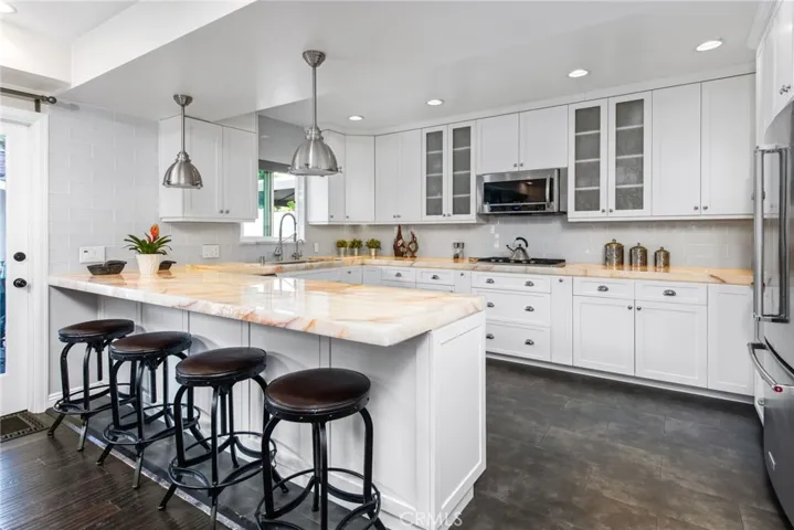 kitchen with illuminated quartzite counter tops