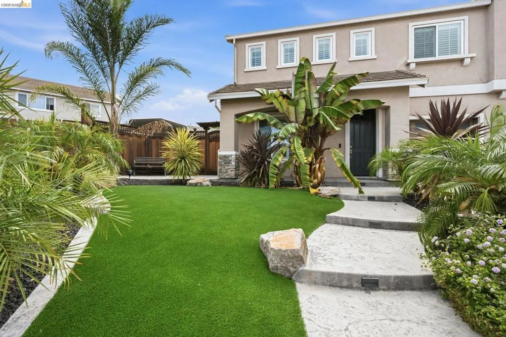 Contemporary stucco exterior with stone accents
