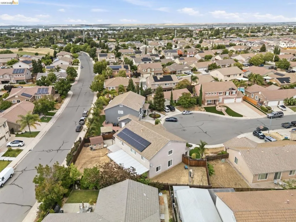 Aerial perspective highlighting a residential streetscape with various single-family residences
