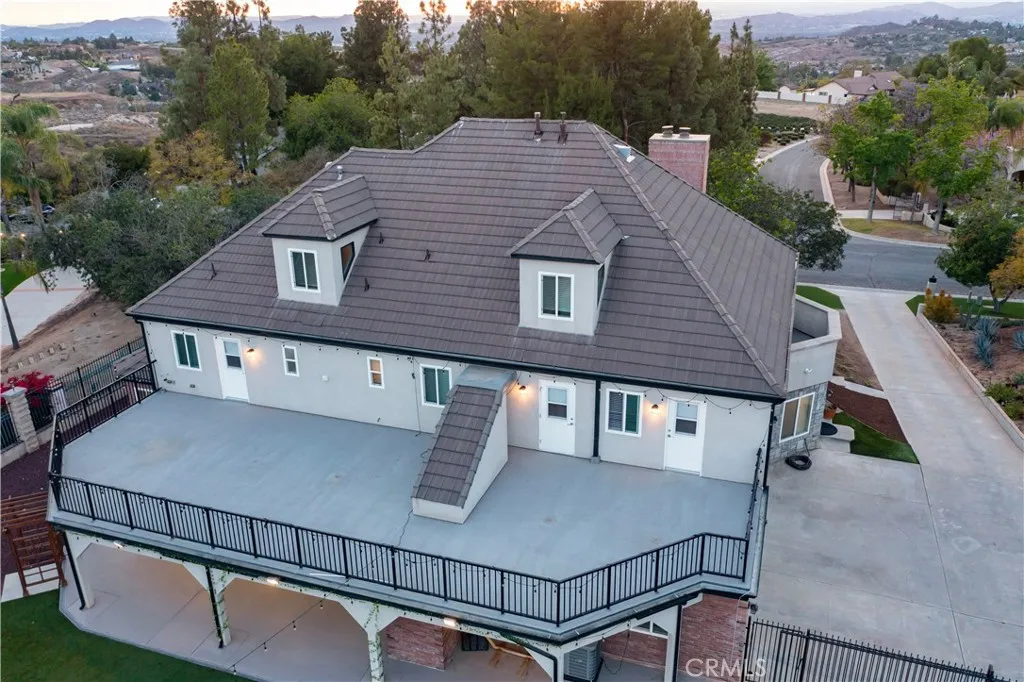 Lower patio has enclosed staircase up to 2nd story balcony