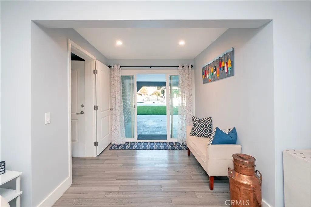 Storage area to left leads to 3 car garage