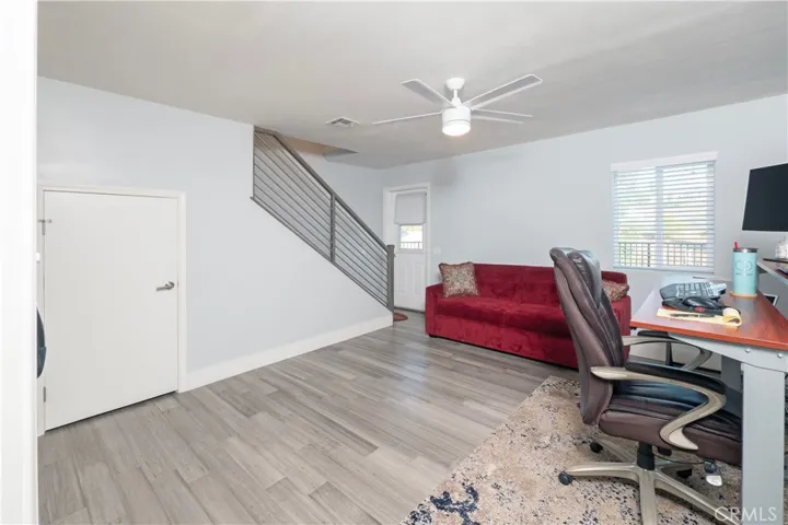 2nd floor bed w/ other staircase to 3rd floor. Door to balcony
