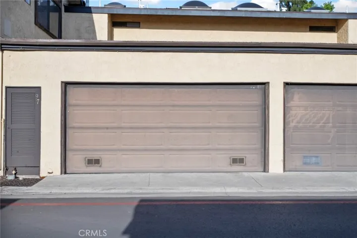 One additional parking spot, between fire lane marker & garage door.