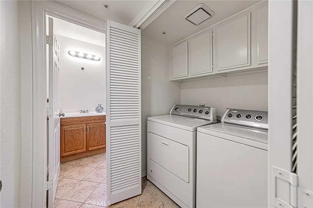 Convenient downstairs hallway laundry closet with included washer and dryer