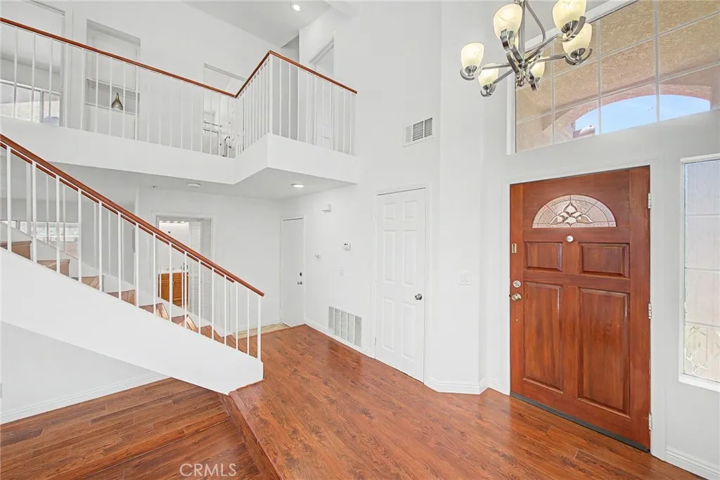 Beautiful laminate wood flooring and custom tile throughout