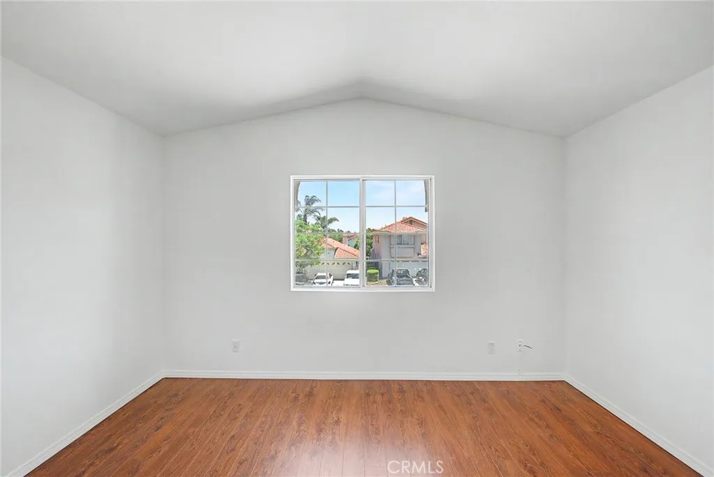 Fifth bedroom offering flexible living space, abundant natural light, and pleasant views