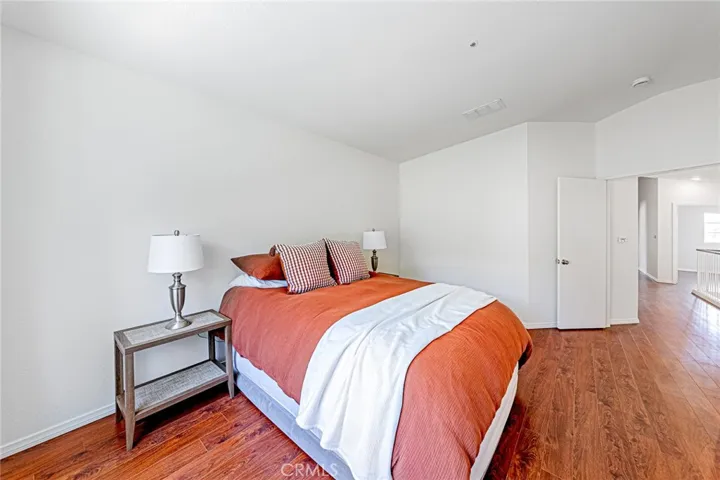 Spacious primary bedroom offering comfort and natural light