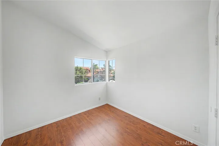 Fourth bedroom with abundant natural light and a pleasant views