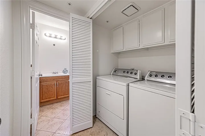 Convenient downstairs hallway laundry closet with included washer and dryer