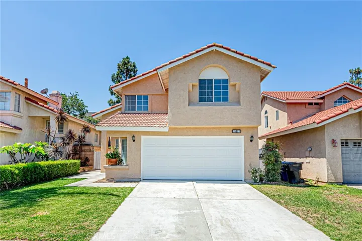 Attached 2-car garage and extended driveway for additional parking space