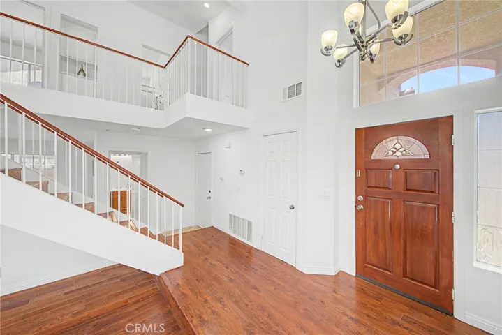 Beautiful laminate wood flooring and custom tile throughout