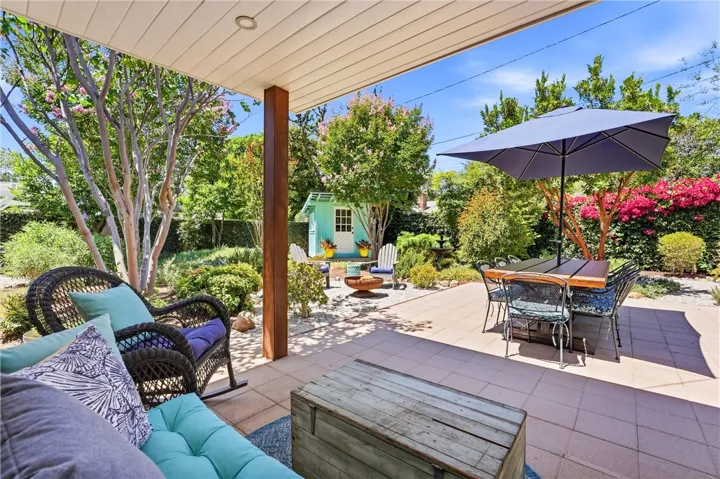 This is the place to end your day, under the covered patio looking onto this incredible backyard.