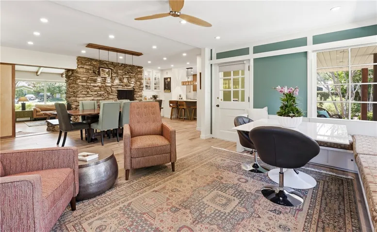 The family room blends into the dining room and kitchen. The fireplace in the dining room makes winter dinners an event.