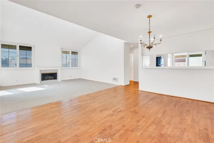 Dining area and living room with fireplace