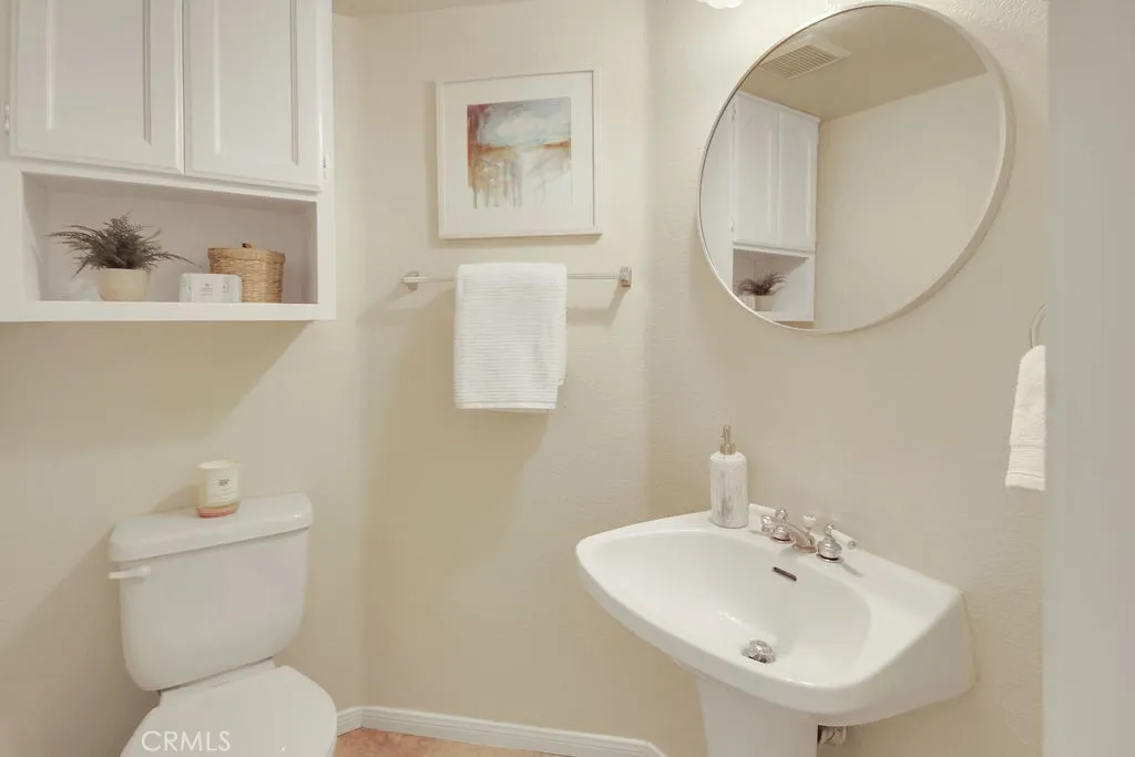 A convenient main-level powder room offers guests both comfort and privacy.
