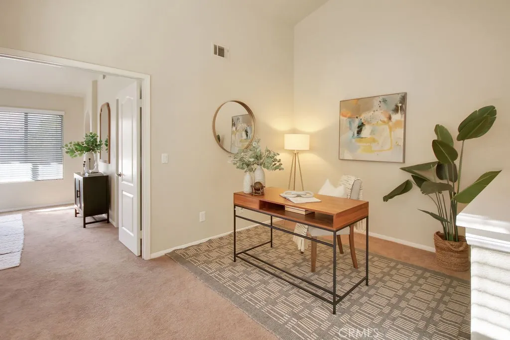 The versatile upstairs loft provides the perfect space for a home office, study area, or additional living room.
