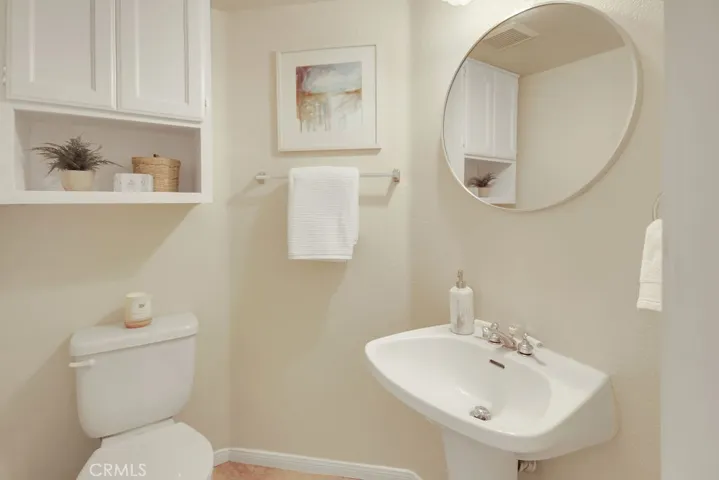 A convenient main-level powder room offers guests both comfort and privacy.