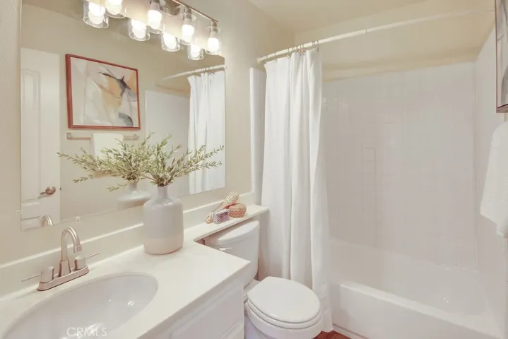 A full secondary bathroom features a tub/shower combination and a clean, neutral design ready for your personal touch.