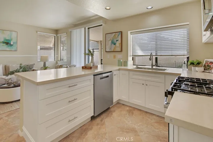 The open-concept kitchen seamlessly connects to the dining and living areas, making entertaining effortless.