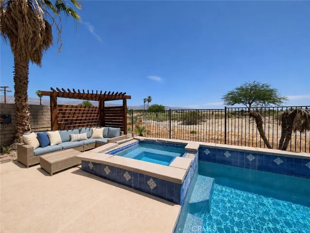 This image has been digitally enhanced to showcase the potential for this beautiful pool oasis and patio.  The pool and spa are in need of repair.