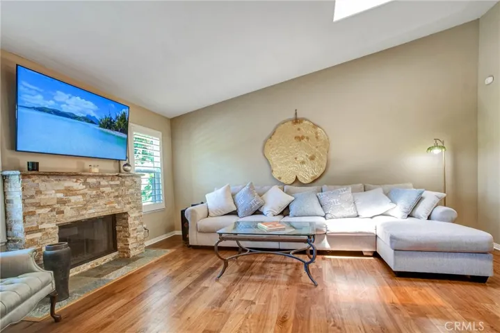 Living Room with beautiful walnut flooring & Fireplace