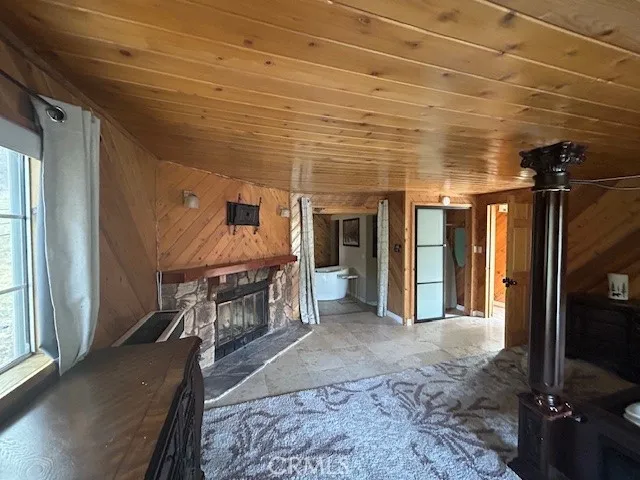Primary bedroom has a rock fireplace