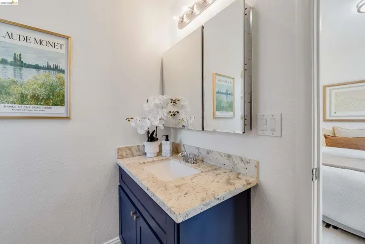 Bathroom vanity with a granite countertop and an undermount sink