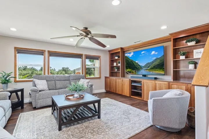 Family room with built in entertainment center and views.