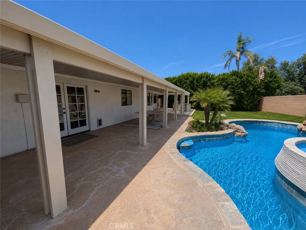 Image has been digitally enhanced to showcase what the backyard can potentially look like.  The backyard and pool and spa are in need of repair.