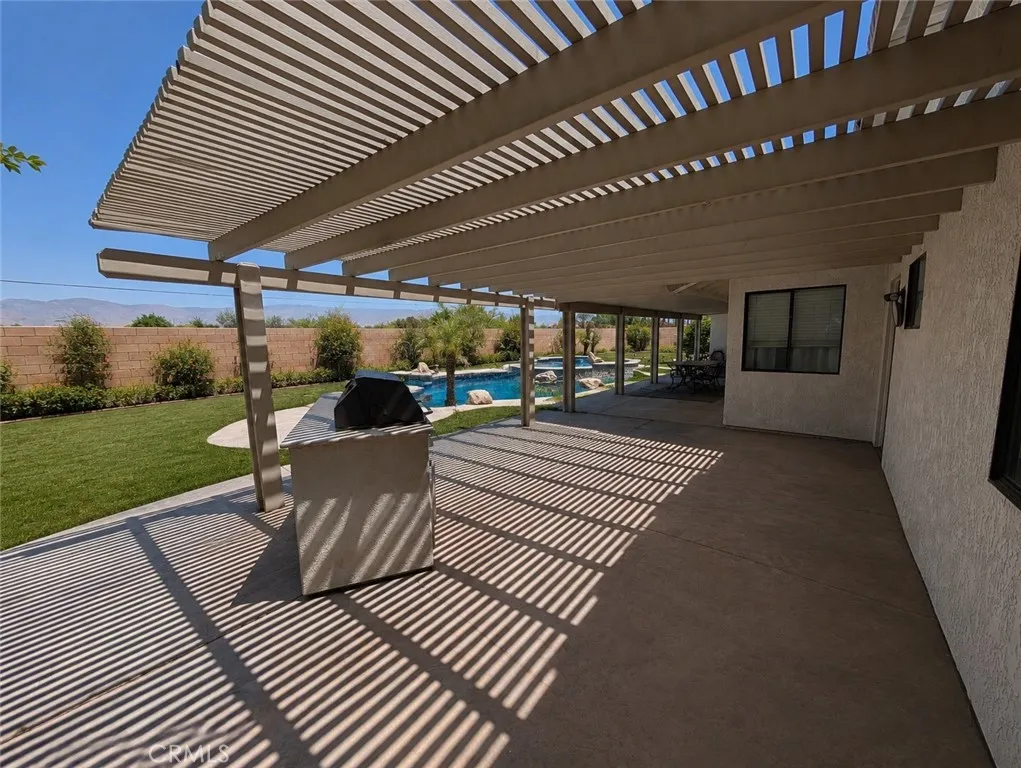Image has been digitally enhanced to showcase what the backyard can potentially look like.  The backyard and pool and spa are in need of repair.