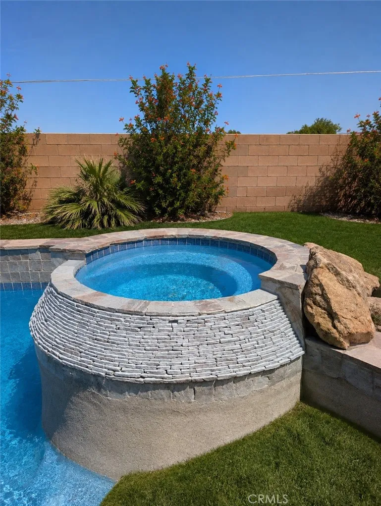 Image has been digitally enhanced to showcase what the backyard can potentially look like.  The backyard and pool and spa are in need of repair.